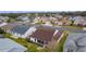 Aerial view of house and surrounding neighborhood at 1216 Addison Ave, The Villages, FL 32162