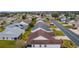 Aerial view of house and surrounding neighborhood at 1216 Addison Ave, The Villages, FL 32162