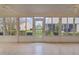 Bright Florida room with view of backyard at 1216 Addison Ave, The Villages, FL 32162