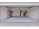 Attached garage with shelving and ample space for storage at 1216 Addison Ave, The Villages, FL 32162