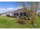 Single-story house with screened porch and well-maintained landscaping at 1216 Addison Ave, The Villages, FL 32162