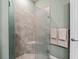 Shower with glass enclosure and built-in bench seating at 12213 Se 176Th Loop, Summerfield, FL 34491