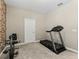 Home gym featuring treadmill and exercise bike at 12213 Se 176Th Loop, Summerfield, FL 34491