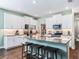 Kitchen island with seating and granite countertops at 12213 Se 176Th Loop, Summerfield, FL 34491