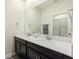 Modern bathroom with double vanity and updated fixtures at 1257 Challenge Dr, Davenport, FL 33896