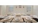 Elegant dining area with a large table set for eight at 1257 Challenge Dr, Davenport, FL 33896