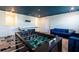 An interior view showcases a game room, foosball table and air hockey table at 1257 Challenge Dr, Davenport, FL 33896