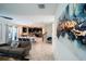 Open-concept living area flows into a kitchen with dark cabinetry and a bright dining space at 1257 Challenge Dr, Davenport, FL 33896