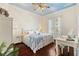 Bright bedroom with a queen-size bed, and ensuite vanity at 1276 Bennett Pl, The Villages, FL 32162