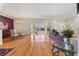 Bright dining room with hardwood floors, chandelier, and access to lanai at 1276 Bennett Pl, The Villages, FL 32162