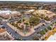 Aerial view of community shopping center with stores, restaurants, and parking at 1276 Bennett Pl, The Villages, FL 32162