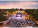 Aerial view of community town square with open air concert venue at dusk at 1276 Bennett Pl, The Villages, FL 32162