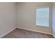 Simple carpeted bedroom with window and blinds at 1350 Cavender Creek Rd, Minneola, FL 34715