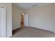 Bedroom with carpet, a mirrored ball, and access to a hallway at 1350 Cavender Creek Rd, Minneola, FL 34715