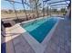 Screened-in rectangular pool with a spa at 1350 Cavender Creek Rd, Minneola, FL 34715