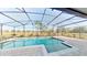 Screened-in rectangular pool with a spa at 1350 Cavender Creek Rd, Minneola, FL 34715