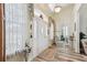 Bright foyer showcasing stylish floors, a charming decor, and an arched window above the front door at 13718 County Road 450, Umatilla, FL 32784