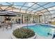 Beautiful screened-in pool and patio area, ideal for outdoor entertaining and relaxation at 13718 County Road 450, Umatilla, FL 32784