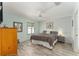 Large bedroom with king-size bed and light wood flooring at 1410 Conchas Dr, The Villages, FL 32162