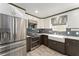 Modern kitchen with stainless steel appliances and farmhouse sink at 1410 Conchas Dr, The Villages, FL 32162