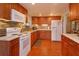 Bright kitchen featuring granite countertops and ample wood cabinetry at 1420 Anderson St, Clermont, FL 34711