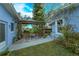 Relaxing patio with seating area and pergola providing shade at 1420 Anderson St, Clermont, FL 34711