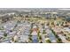 Aerial view of neighborhood near golf course at 1548 Loris Loop, The Villages, FL 32162