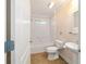 Clean bathroom with a tub, toilet and sink at 1548 Loris Loop, The Villages, FL 32162