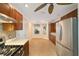 Well-lit kitchen with stainless steel appliances, breakfast nook, and tile floors at 1548 Loris Loop, The Villages, FL 32162