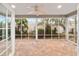 Enclosed porch with paver floor and ceiling fan at 1548 Loris Loop, The Villages, FL 32162