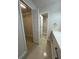 Bathroom with a closet, modern vanity and tiled shower at 1562 Lawndale Cir, Winter Park, FL 32792