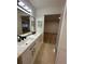 Bathroom featuring double sinks, sleek black fixtures, and stylish lighting at 1562 Lawndale Cir, Winter Park, FL 32792