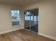 Bedroom with sliding glass doors to a screened patio at 1562 Lawndale Cir, Winter Park, FL 32792