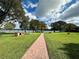 Scenic community park with a brick path, picnic tables, and water views at 1562 Lawndale Cir, Winter Park, FL 32792