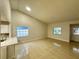 Bright and airy living room with tile floors and kitchen island at 1562 Lawndale Cir, Winter Park, FL 32792