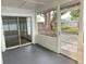 View of a screened porch with a view to a fenced backyard at 1562 Lawndale Cir, Winter Park, FL 32792