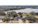 Aerial view of house near lake, showcasing surrounding landscape and neighborhood at 16029 Worthington N Blvd, Mascotte, FL 34753