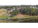 Aerial view of property, showing backyard and lake access at 16029 Worthington N Blvd, Mascotte, FL 34753