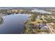 Aerial view showcasing property location on lakefront at 16029 Worthington N Blvd, Mascotte, FL 34753