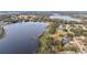 Aerial view of lakefront property and surrounding area at 16029 Worthington N Blvd, Mascotte, FL 34753