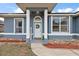 Inviting front entrance with columns and a wreath at 16029 Worthington N Blvd, Mascotte, FL 34753