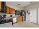 Kitchen with stainless steel appliances and wood cabinets at 16029 Worthington N Blvd, Mascotte, FL 34753