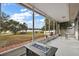 Spacious screened porch with lake view and fire pit at 16029 Worthington N Blvd, Mascotte, FL 34753