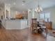 Bright dining room with hardwood floors, a charming table, and four chairs at 16841 Se 84Th Colerain Cir, The Villages, FL 32162