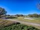 Landscaped golf course with walking path and clear blue sky at 16841 Se 84Th Colerain Cir, The Villages, FL 32162