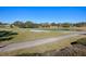 Golf course with pond, sand trap and walking path at 16841 Se 84Th Colerain Cir, The Villages, FL 32162