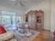 Relaxing living room with hardwood floors and built-in shelving at 16841 Se 84Th Colerain Cir, The Villages, FL 32162