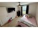 Bedroom with ceiling fan and neutral colored walls at 16929 Tesla Aly, Winter Garden, FL 34787