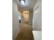 Upstairs hallway with carpet, light fixtures, and access to bedrooms at 16929 Tesla Aly, Winter Garden, FL 34787