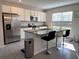 Modern kitchen with stainless steel appliances and granite countertops at 16929 Tesla Aly, Winter Garden, FL 34787